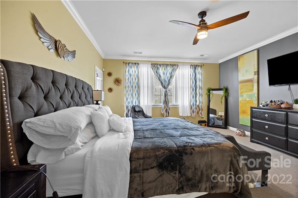1908 Chatooka Lane Waxhaw, NC 28173 - Photo 25 of 47 a bedroom with a bed and a flat screen tv