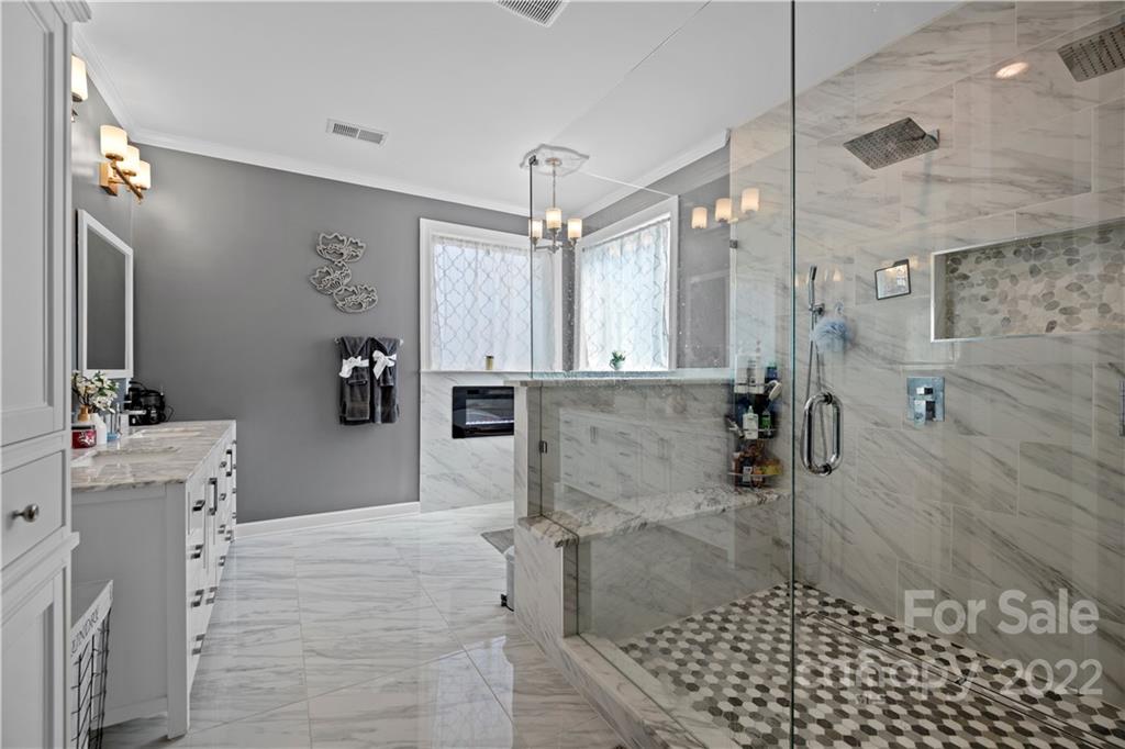 1908 Chatooka Lane Waxhaw, NC 28173 - Photo 27 of 47 a bathroom with a bathtub sink and mirror