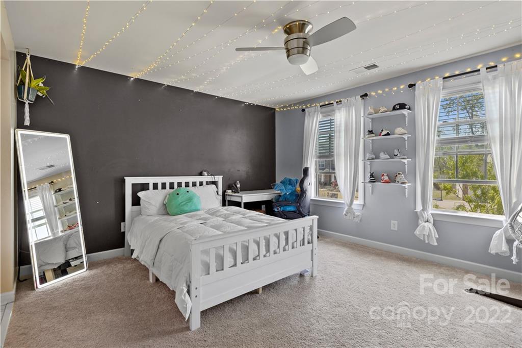 1908 Chatooka Lane Waxhaw, NC 28173 - Photo 34 of 47 a bedroom with a large bed and a large window