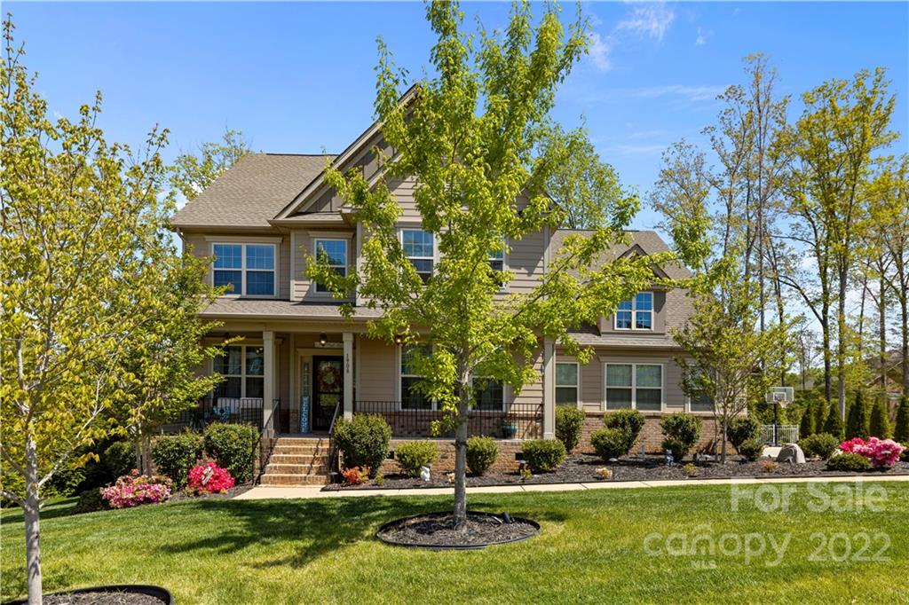 1908 Chatooka Lane Waxhaw, NC 28173 - Photo 4 of 47 a front view of a house with garden and trees
