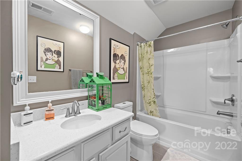 1908 Chatooka Lane Waxhaw, NC 28173 - Photo 45 of 47 a bathroom with a sink a toilet and shower