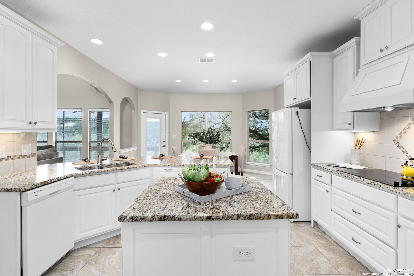 171 Clear Ridge New Braunfels, TX 78132 - Photo 11 of 41 a kitchen with sink a refrigerator and cabinets