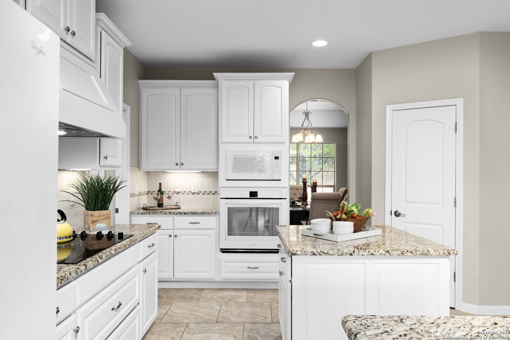 171 Clear Ridge New Braunfels, TX 78132 - Photo 13 of 41 a kitchen with stainless steel appliances granite countertop a stove a sink and a refrigerator