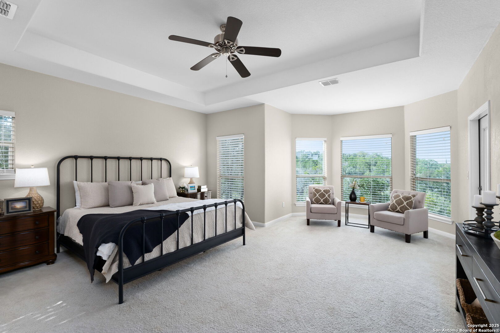 171 Clear Ridge New Braunfels, TX 78132 - Photo 16 of 41 a spacious bedroom with a bed a couch and a large window