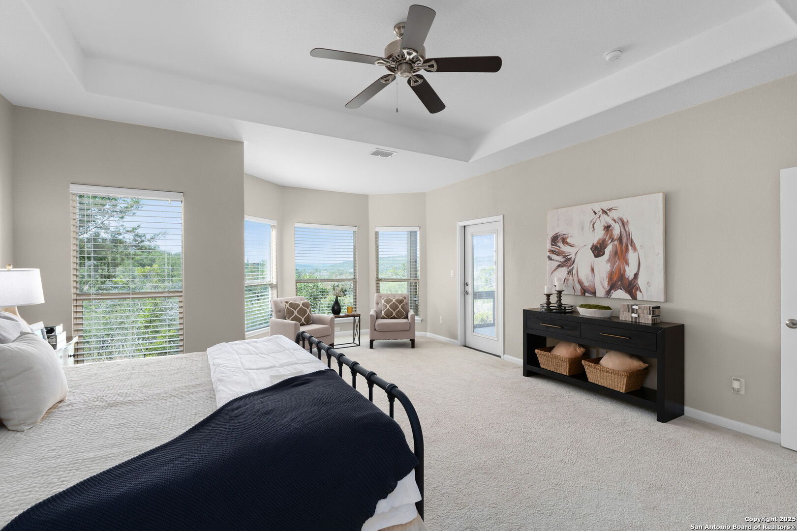 171 Clear Ridge New Braunfels, TX 78132 - Photo 19 of 41 a bedroom with a bed couch and large window