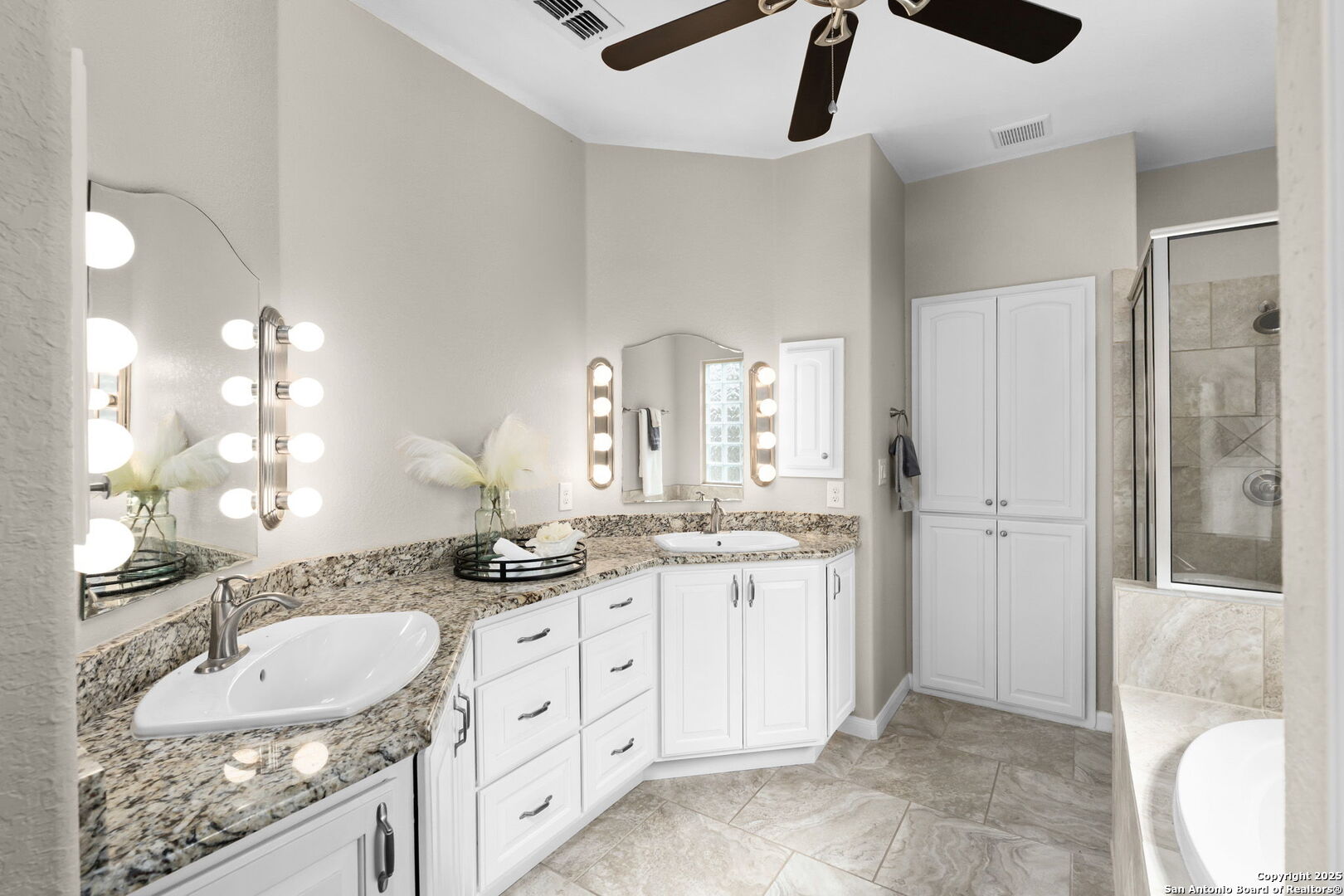 171 Clear Ridge New Braunfels, TX 78132 - Photo 22 of 41 a bathroom with a granite countertop double vanity sink a mirror and a shower