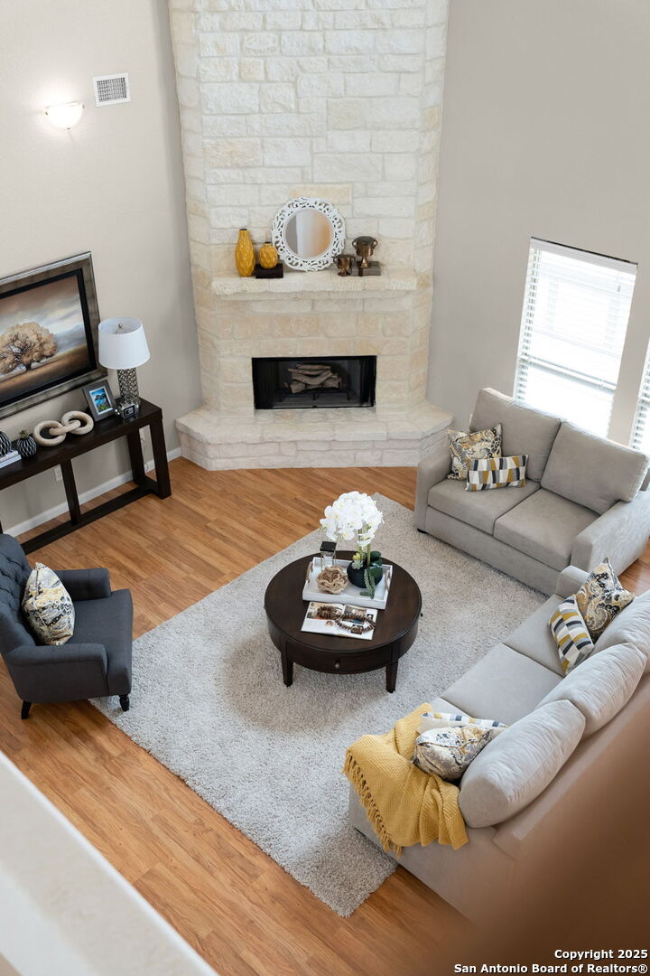 171 Clear Ridge New Braunfels, TX 78132 - Photo 27 of 41 a living room with furniture and a fireplace