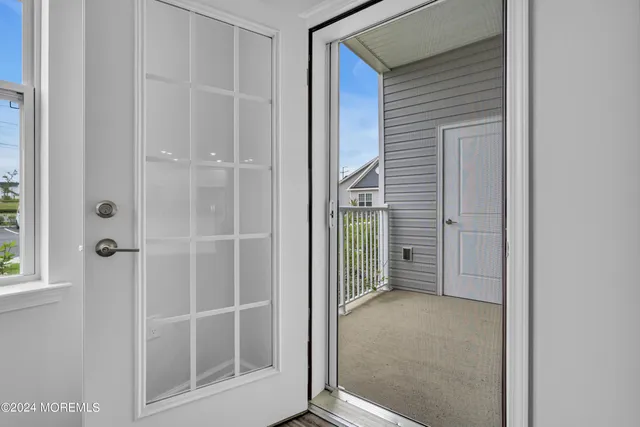 a view of a bathroom with a glass door