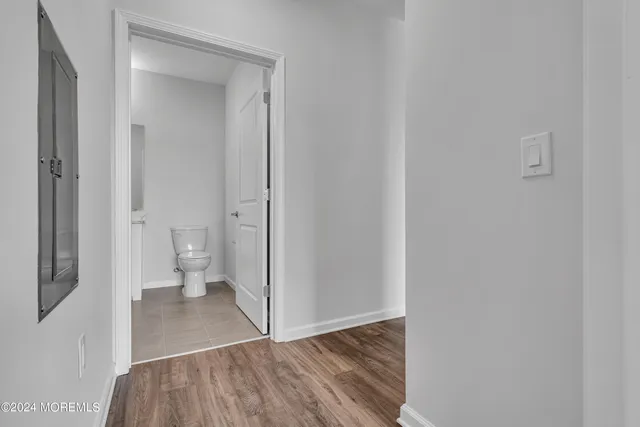 a view of room with wooden floor