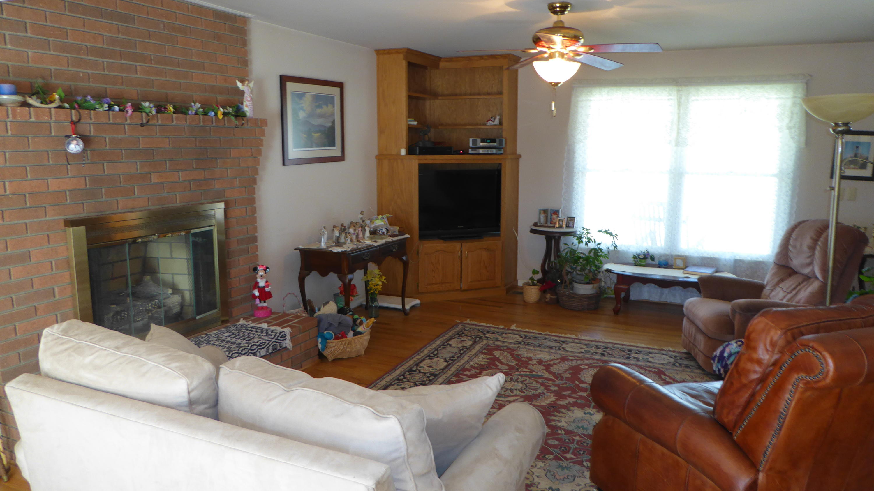 952 Rock Ridge Road Callaway, VA 24067 - Photo 2 of 46 a living room with furniture and a fireplace