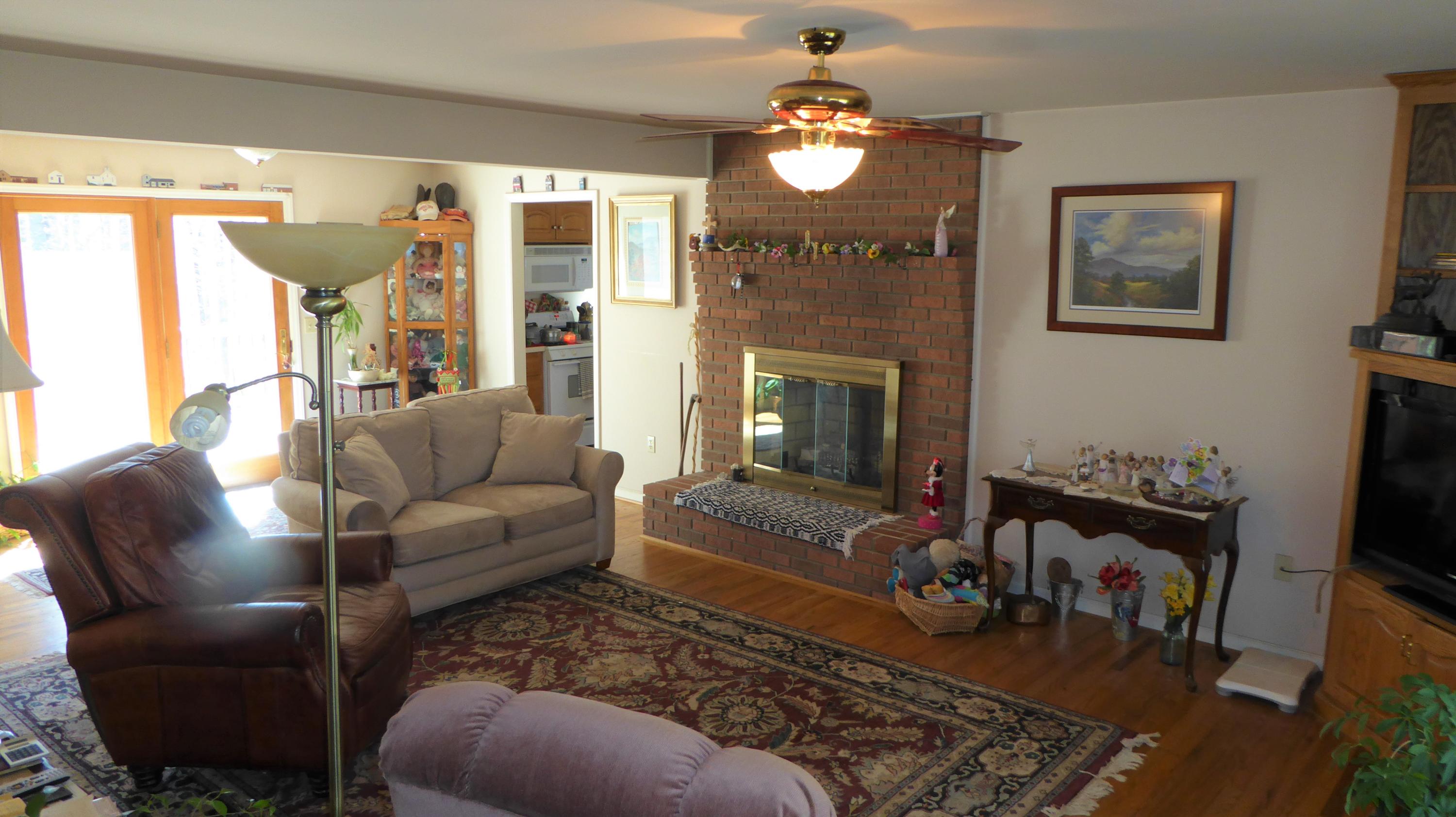 952 Rock Ridge Road Callaway, VA 24067 - Photo 28 of 46 a living room with furniture fireplace and a window