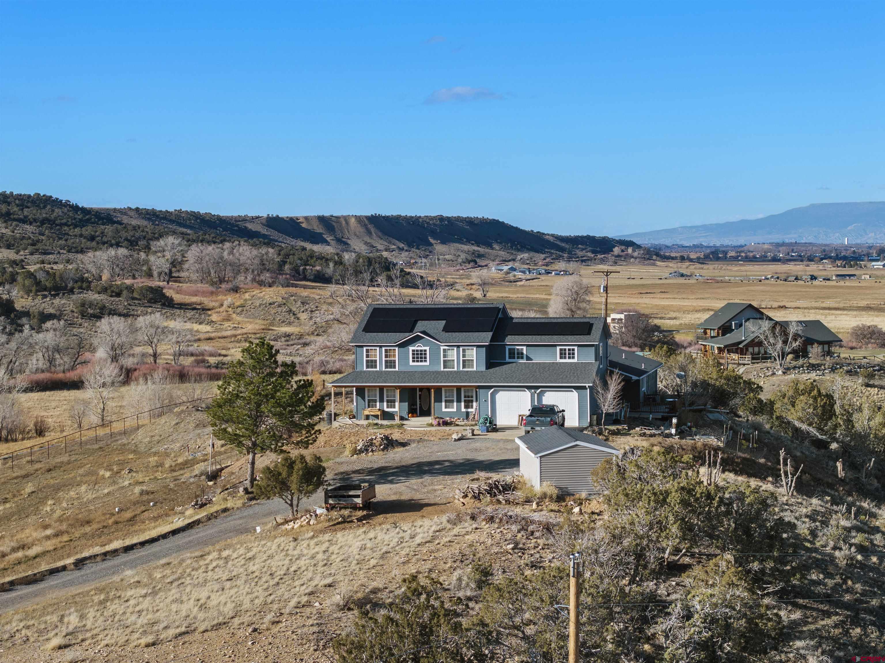 21835 Government Springs Road Montrose, CO 81403 - Photo 2 of 7 a view of a terrace with chairs