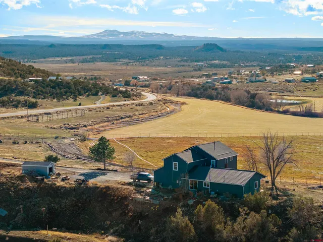 an aerial view of residential building and ocean