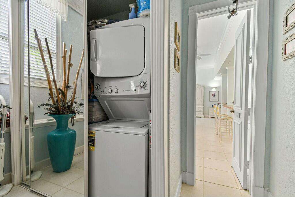 235 Sunrise Avenue, Unit 1050 Palm Beach, FL 33480 - Photo 11 of 29 a utility room with a washer and dryer