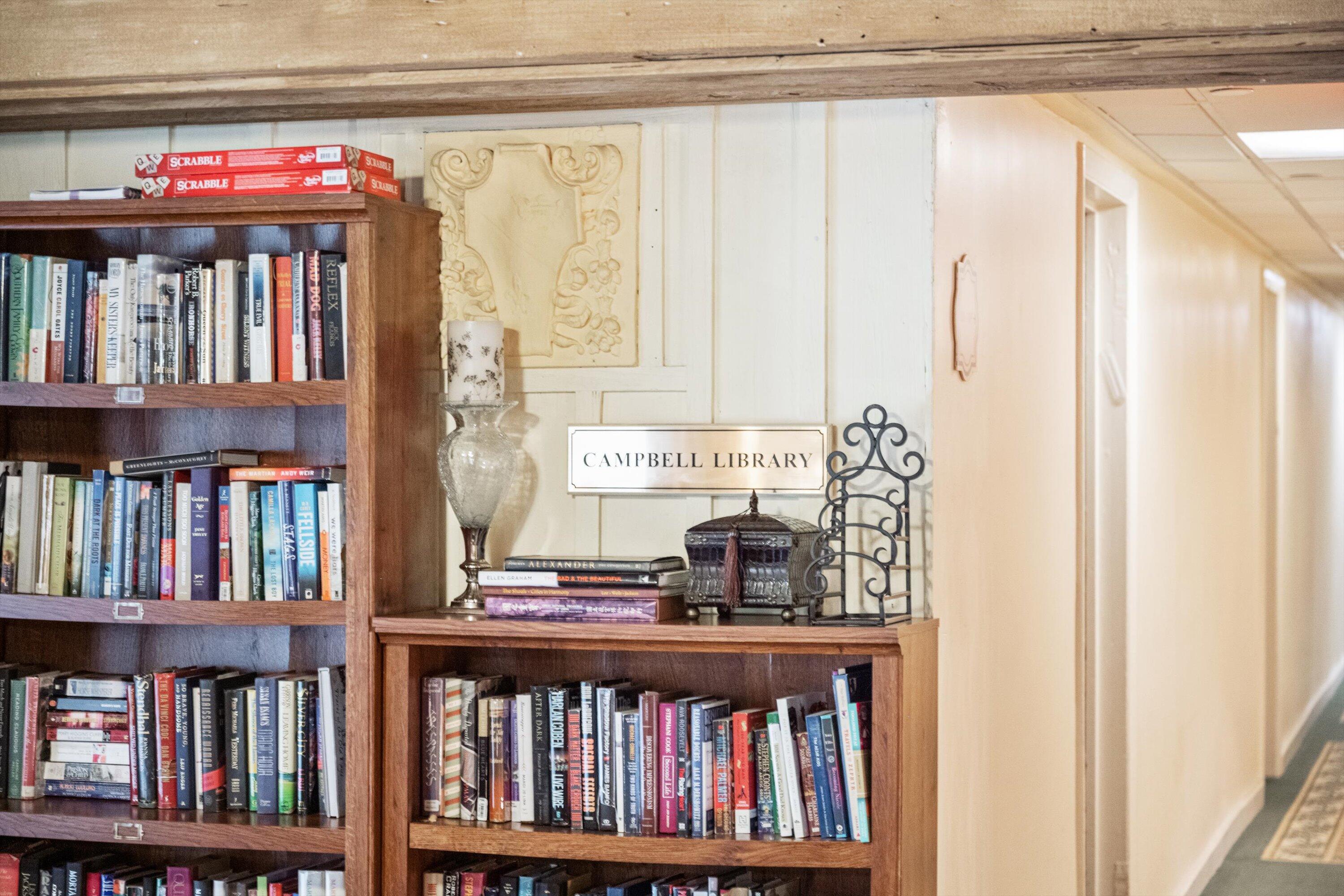 235 Sunrise Avenue, Unit 1050 Palm Beach, FL 33480 - Photo 22 of 29 a view of a book shelf with lots of books