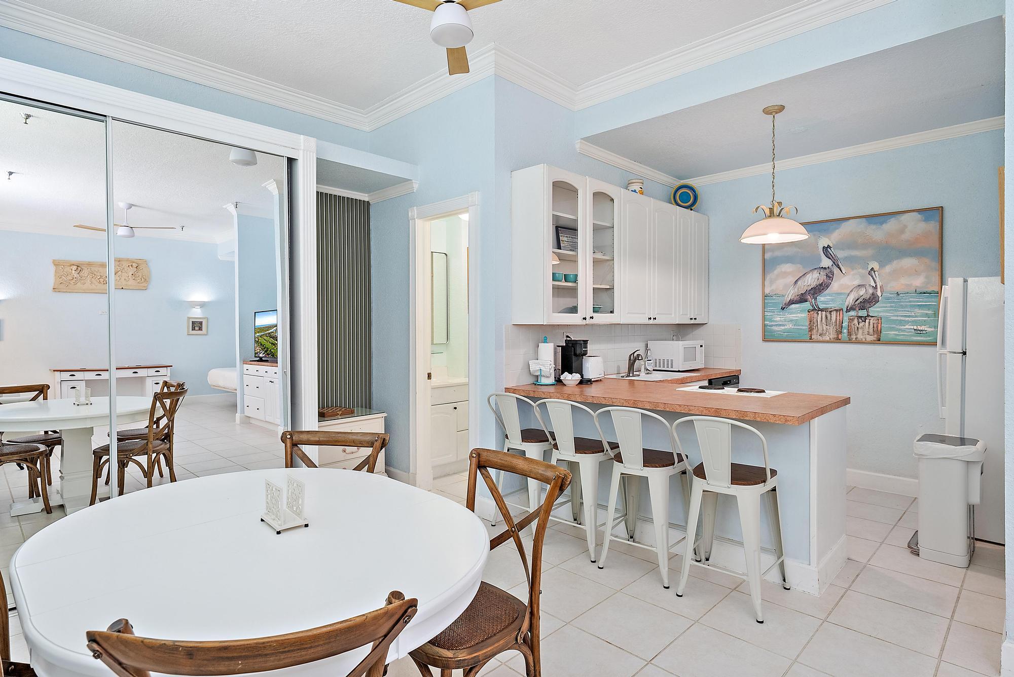 235 Sunrise Avenue, Unit 1050 Palm Beach, FL 33480 - Photo 6 of 29 a view of a dining room with furniture