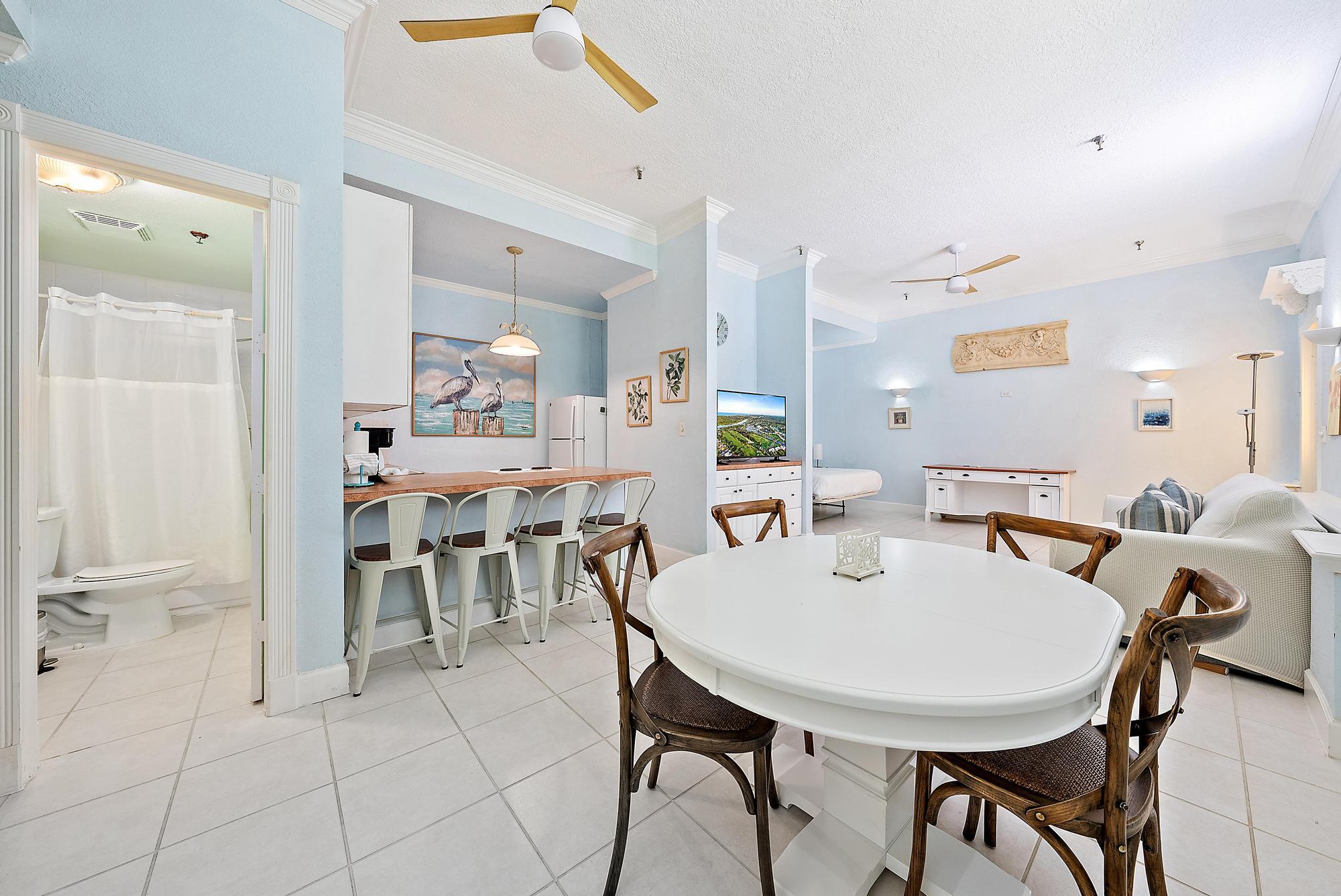 235 Sunrise Avenue, Unit 1050 Palm Beach, FL 33480 - Photo 7 of 29 a view of a dining room with furniture