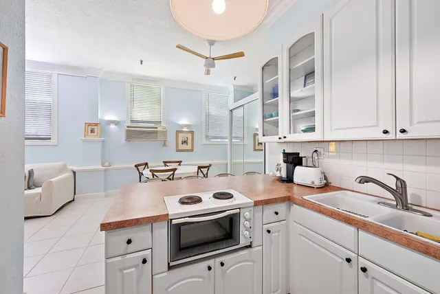 a kitchen with cabinets appliances and a sink