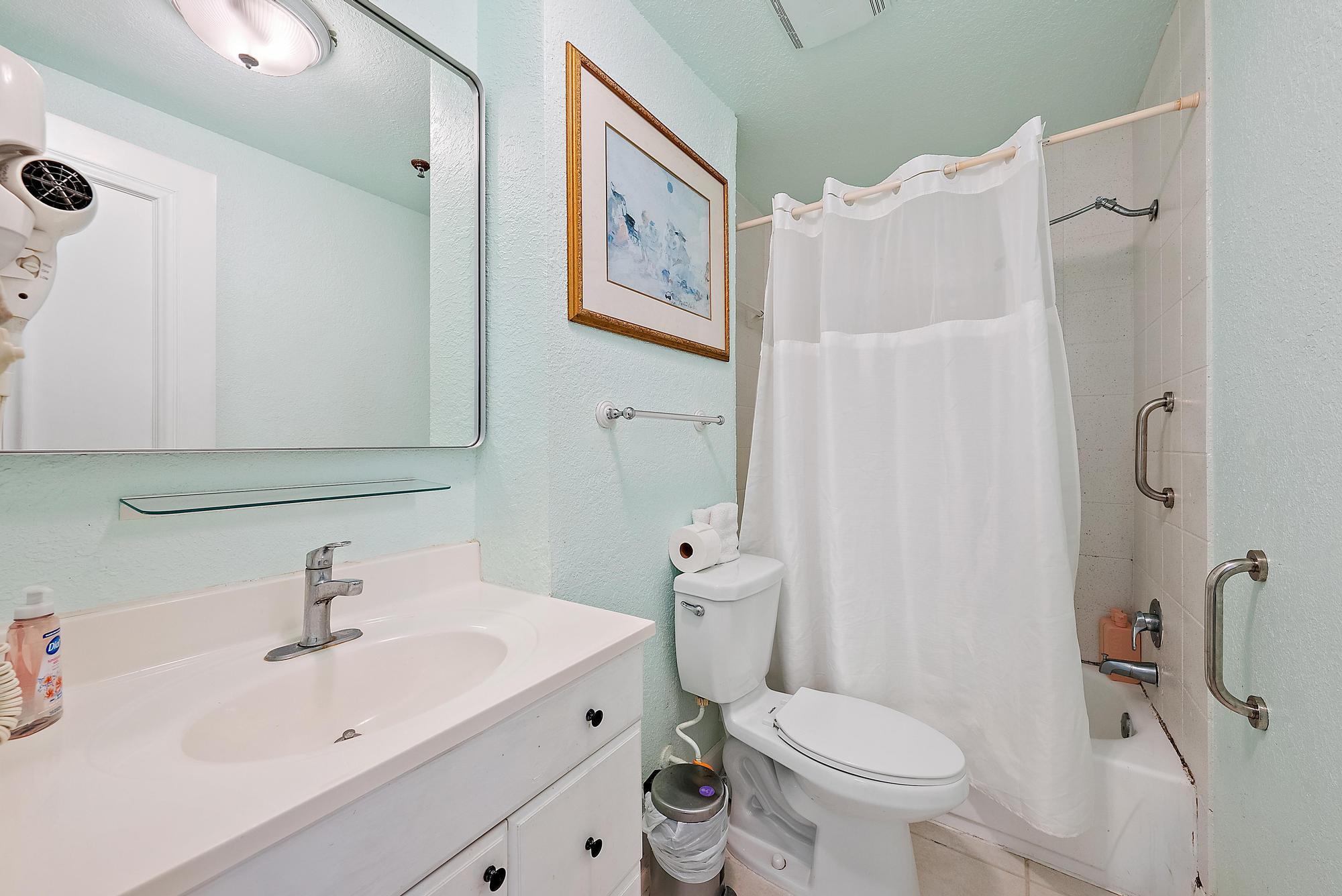 235 Sunrise Avenue, Unit 1050 Palm Beach, FL 33480 - Photo 10 of 29 a bathroom with a sink toilet and shower
