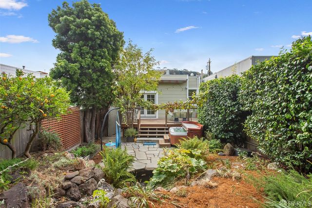 a view of a patio with table and chairs and potted plants