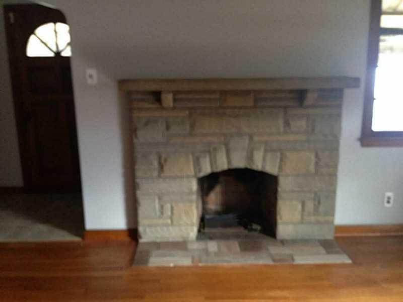 1136 9th Street McKees Rocks, PA 15136 - Photo 7 of 17 Living Room with stone fireplace