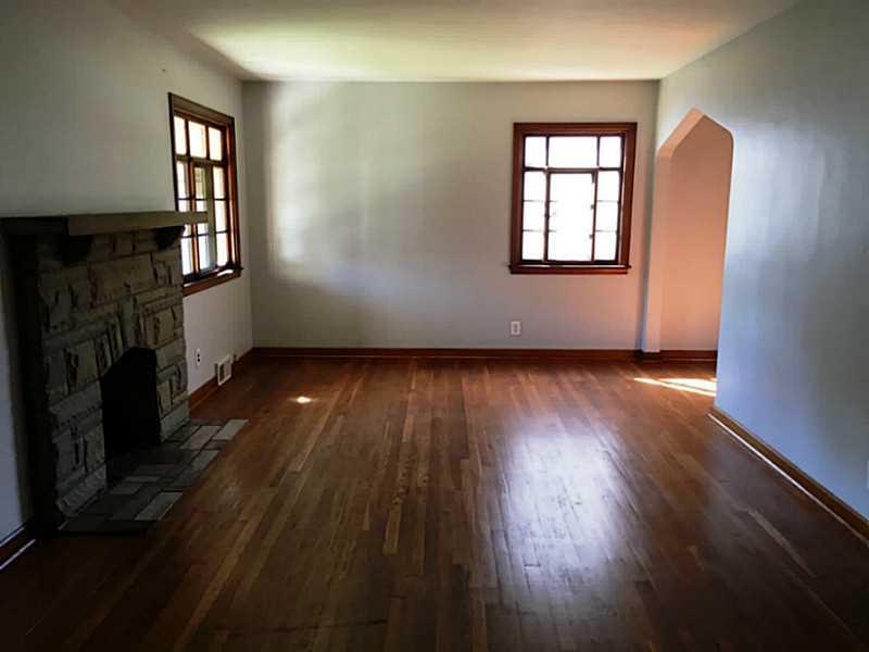 1136 9th Street McKees Rocks, PA 15136 - Photo 8 of 17 Living Room showing beautiful hard wood floors.