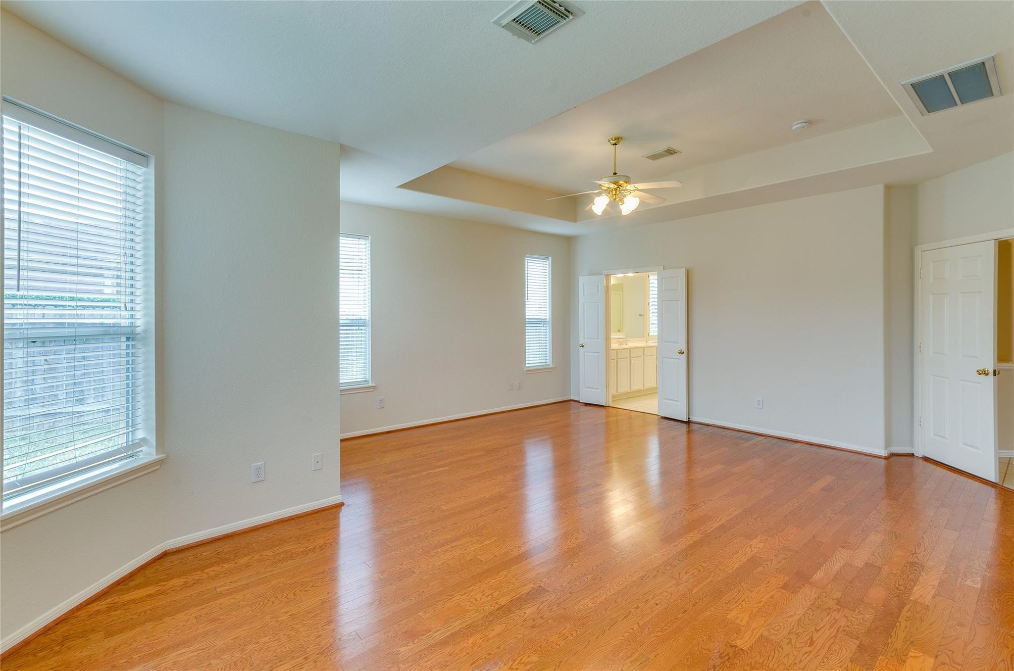 4019 Angel Spring Drive Sugar Land, TX 77479 - Photo 21 of 50 wooden floor in an empty room with a window