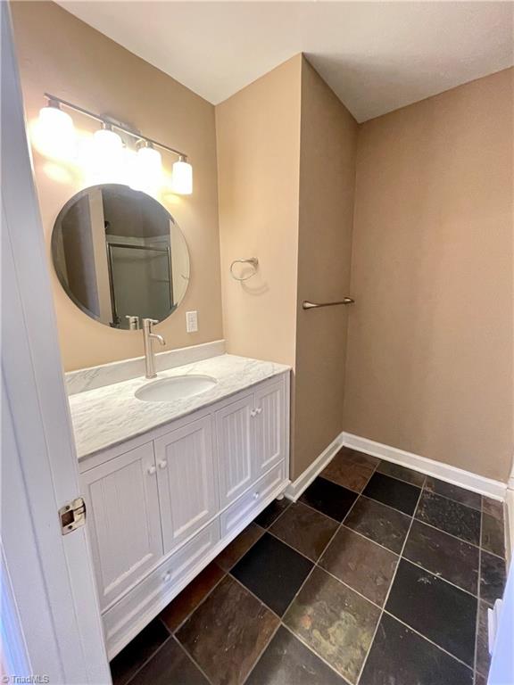 4536 Hamptonshire Drive Raleigh, NC 27613 - Photo 14 of 19 2nd Prim Ensuite Spa w/ walk-in Shower