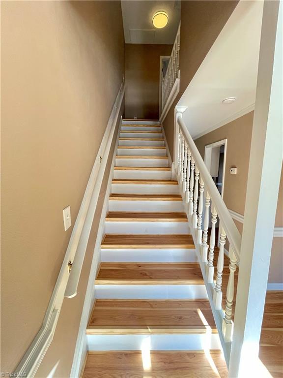 4536 Hamptonshire Drive Raleigh, NC 27613 - Photo 9 of 19 Finished Lam Stairway