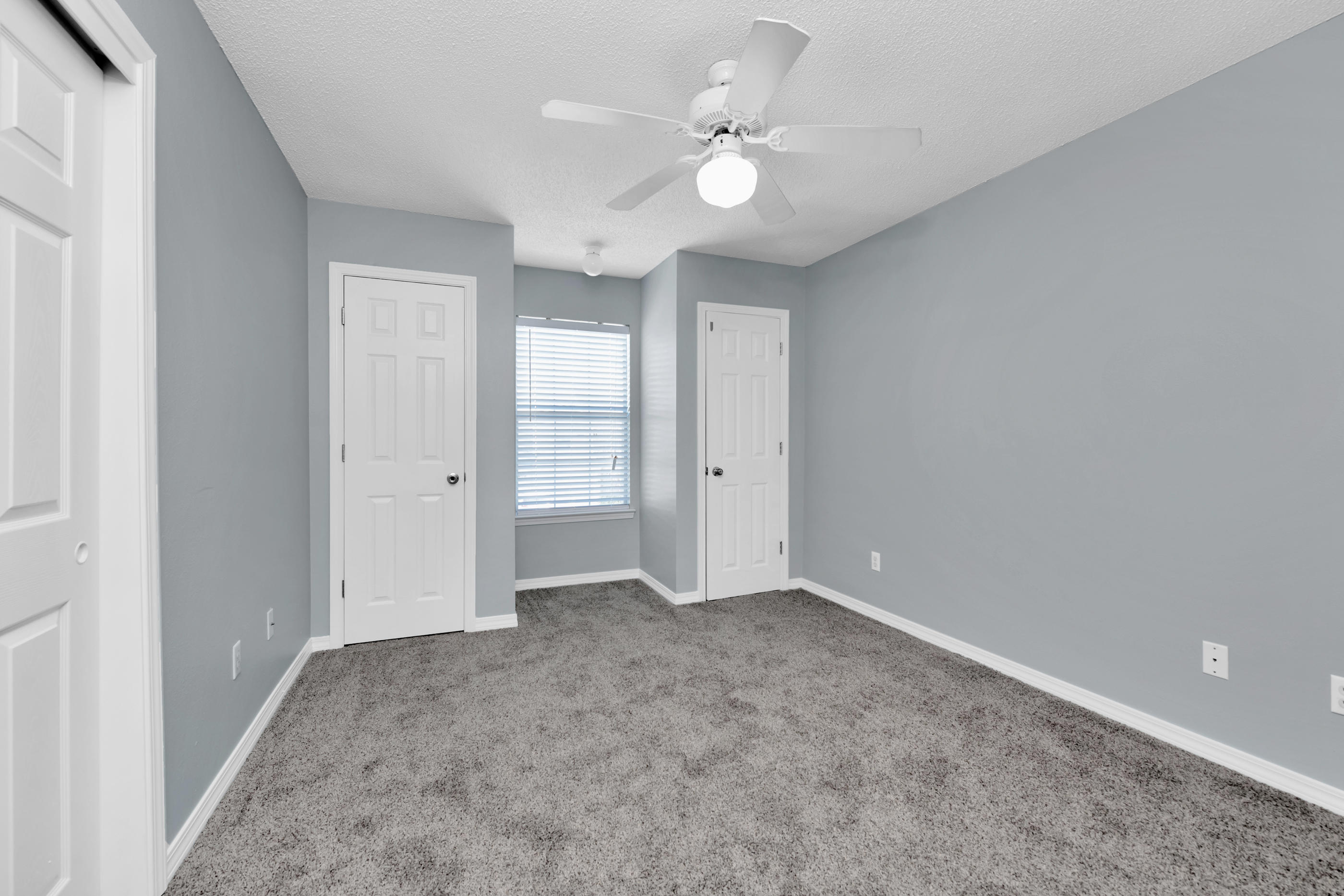 502 Keystone Road Mary Esther, FL 32569 - Photo 13 of 16 an empty room with a ceiling fan and a bathroom