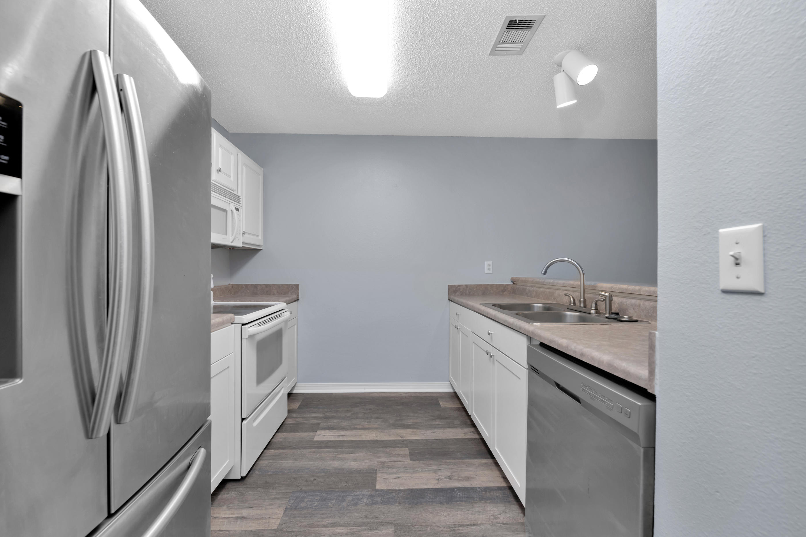 502 Keystone Road Mary Esther, FL 32569 - Photo 5 of 16 a kitchen with stainless steel appliances granite countertop a refrigerator and a stove