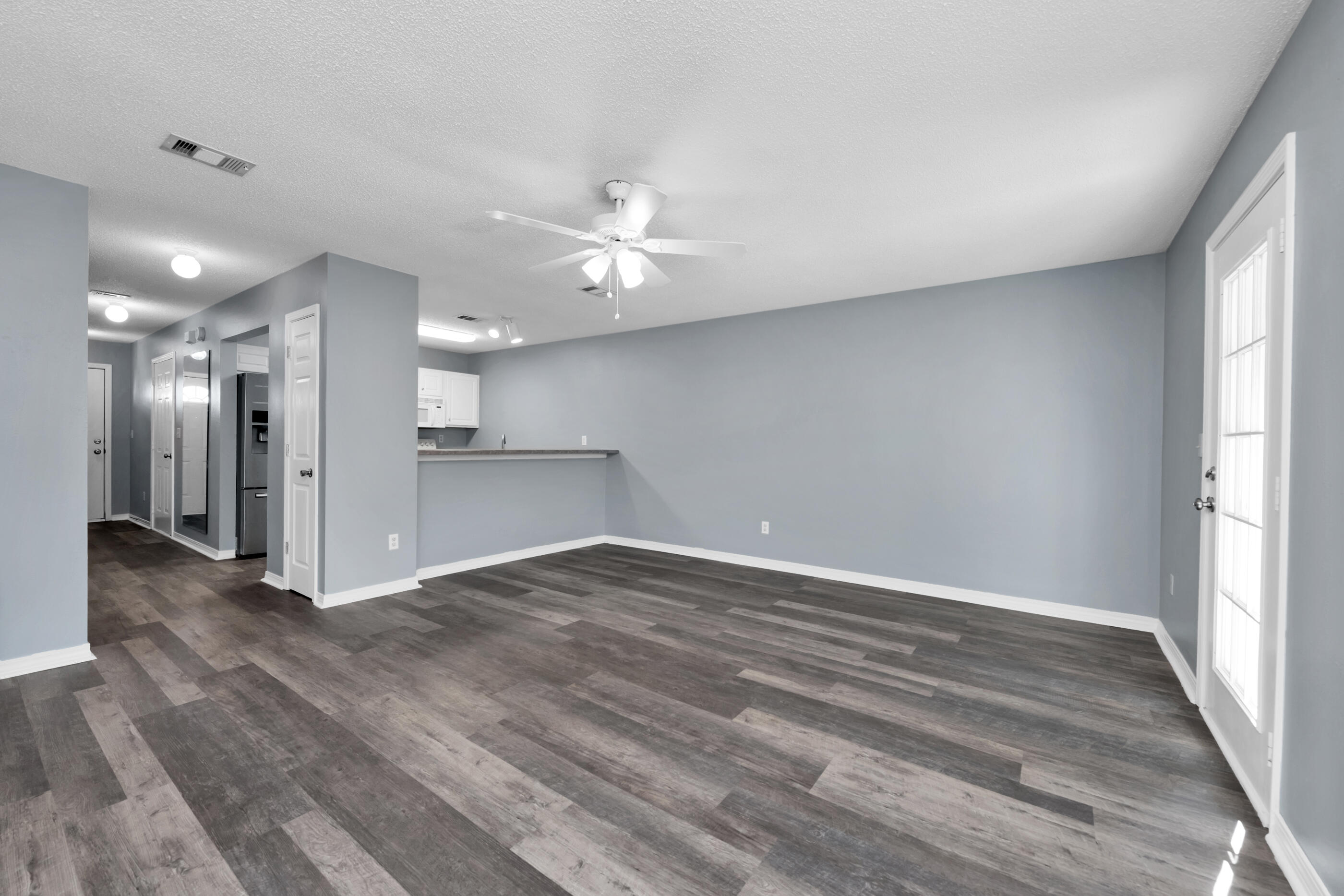 502 Keystone Road Mary Esther, FL 32569 - Photo 7 of 16 wooden floor in an empty room with a window