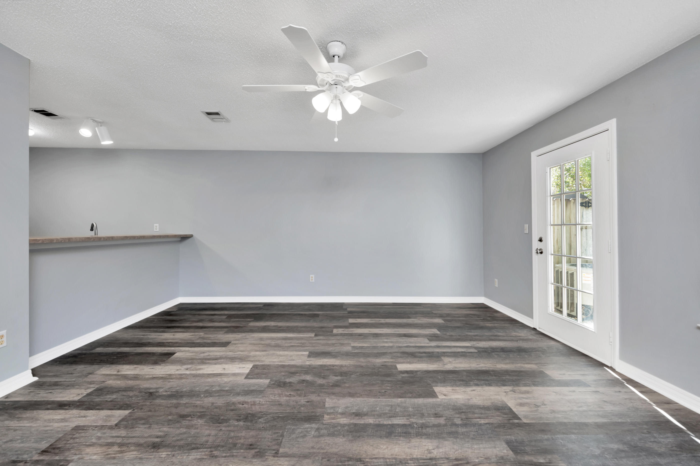 502 Keystone Road Mary Esther, FL 32569 - Photo 8 of 16 wooden floor in an empty room with a window