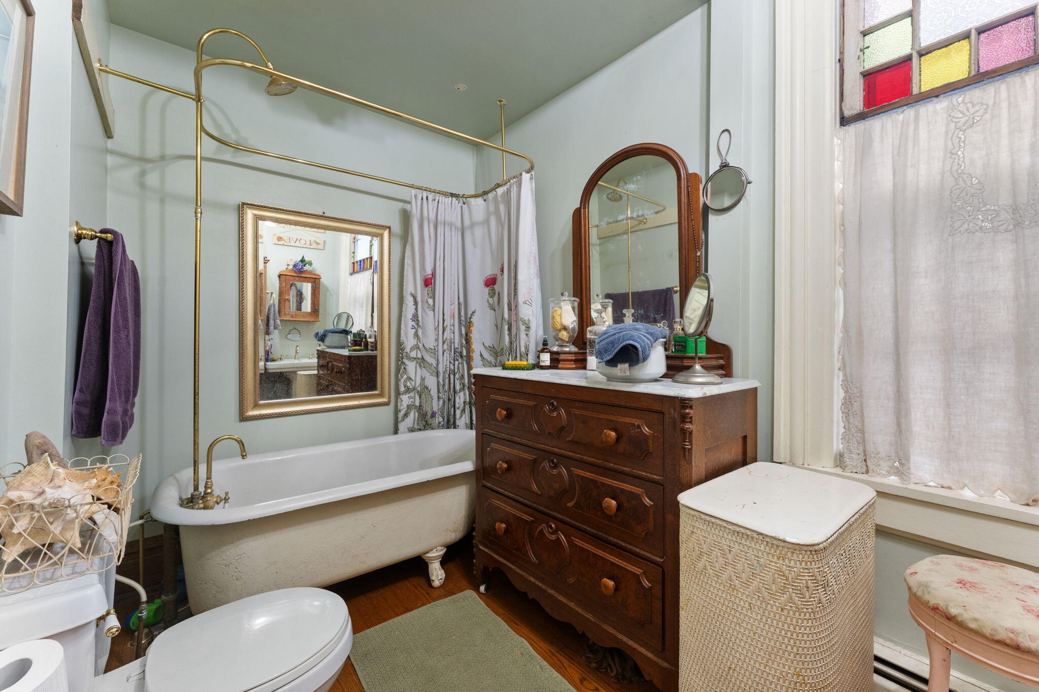 513 3rd Street La Porte, IN 46350 - Photo 15 of 27 a bathroom with a toilet a sink and a mirror