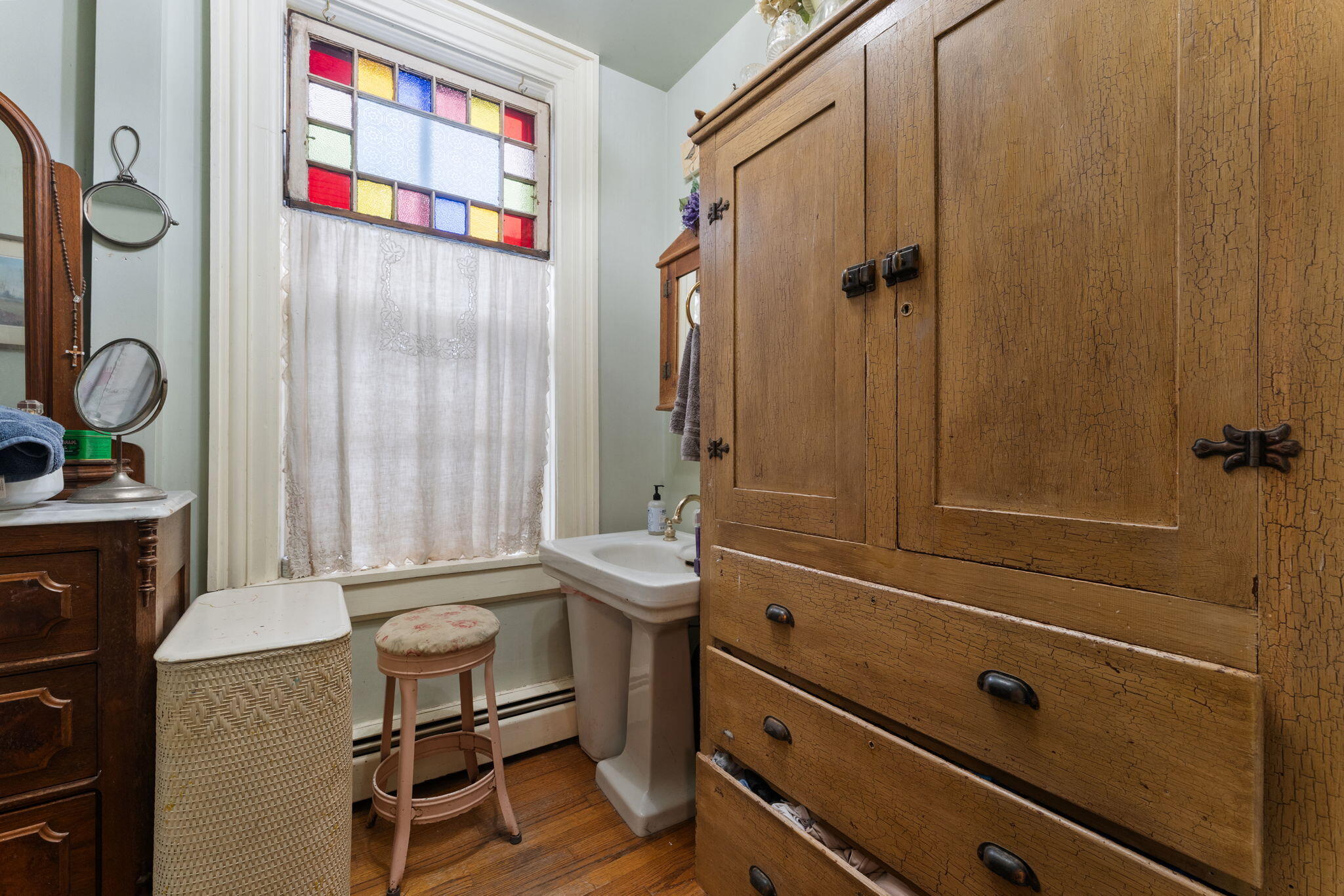 513 3rd Street La Porte, IN 46350 - Photo 16 of 27 a bathroom with a sink a toilet and shower