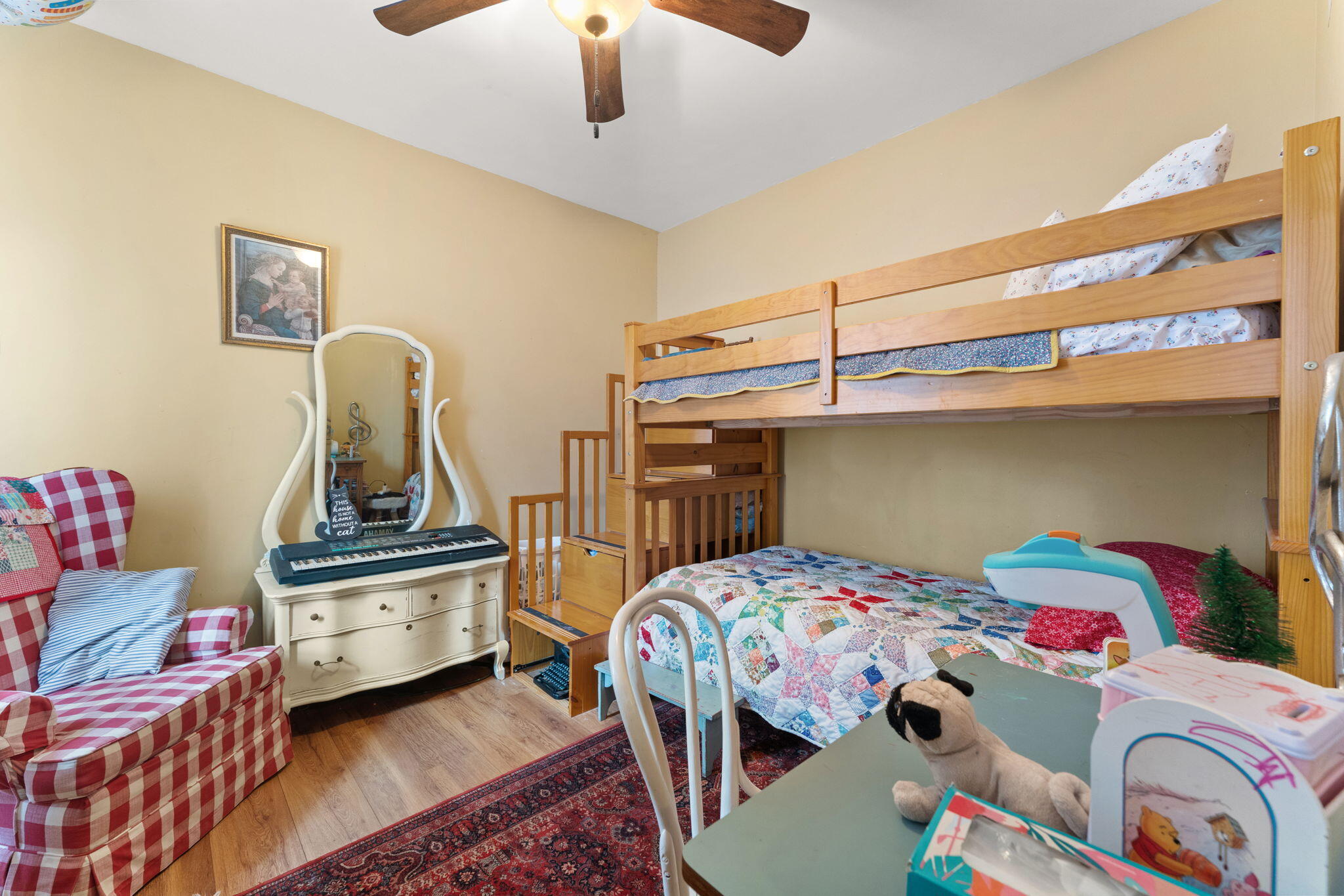 513 3rd Street La Porte, IN 46350 - Photo 19 of 27 a bedroom with a bed and a chandelier