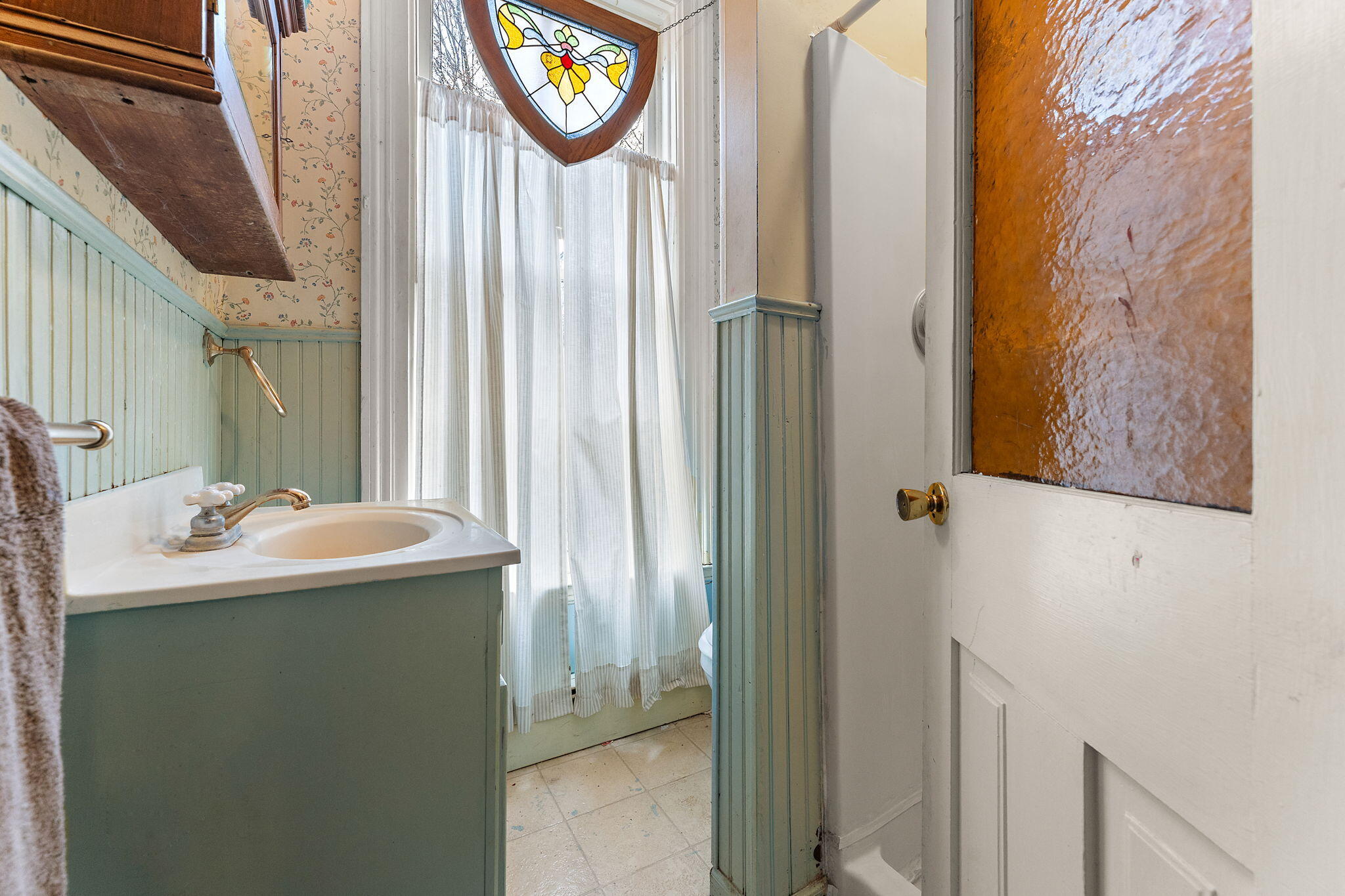 513 3rd Street La Porte, IN 46350 - Photo 25 of 27 a bathroom with a sink and a mirror