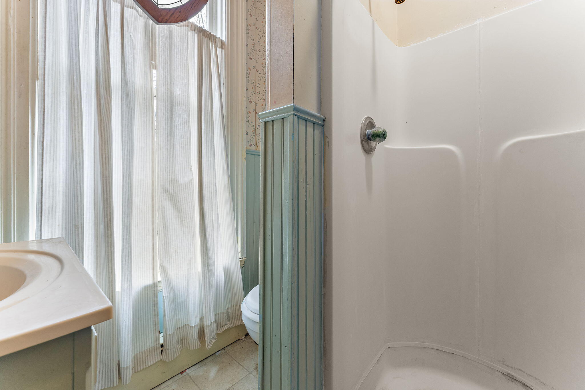 513 3rd Street La Porte, IN 46350 - Photo 26 of 27 a bathroom with a sink a toilet and shower