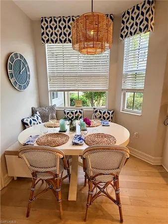 a dining room with furniture and window