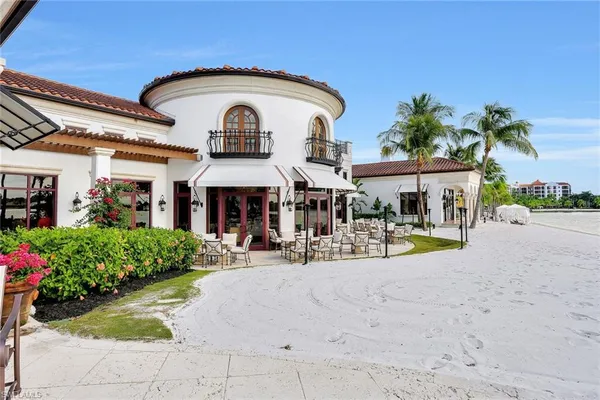 an aerial view of a house with outdoor space and lake view