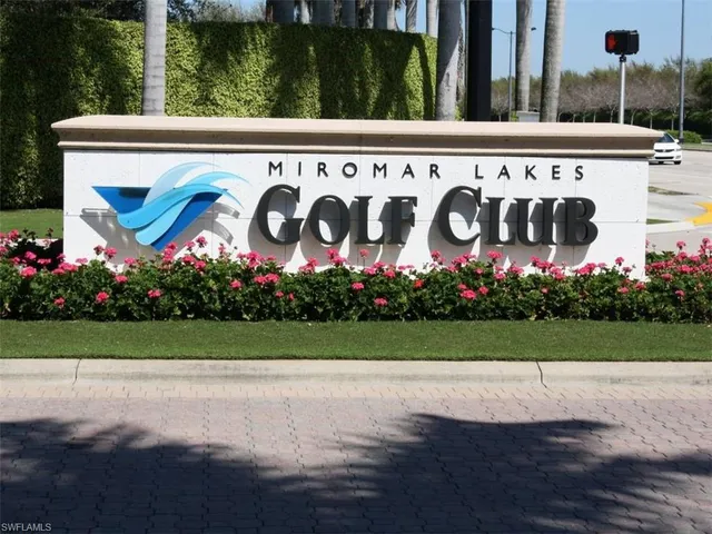 a view of a park with palm trees