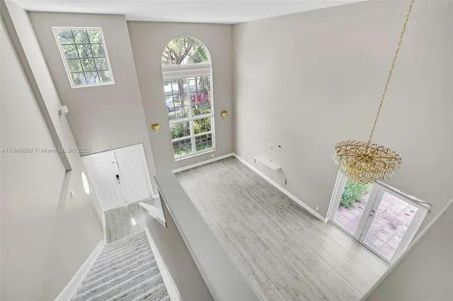 a view of livingroom with furniture wooden floor and front door