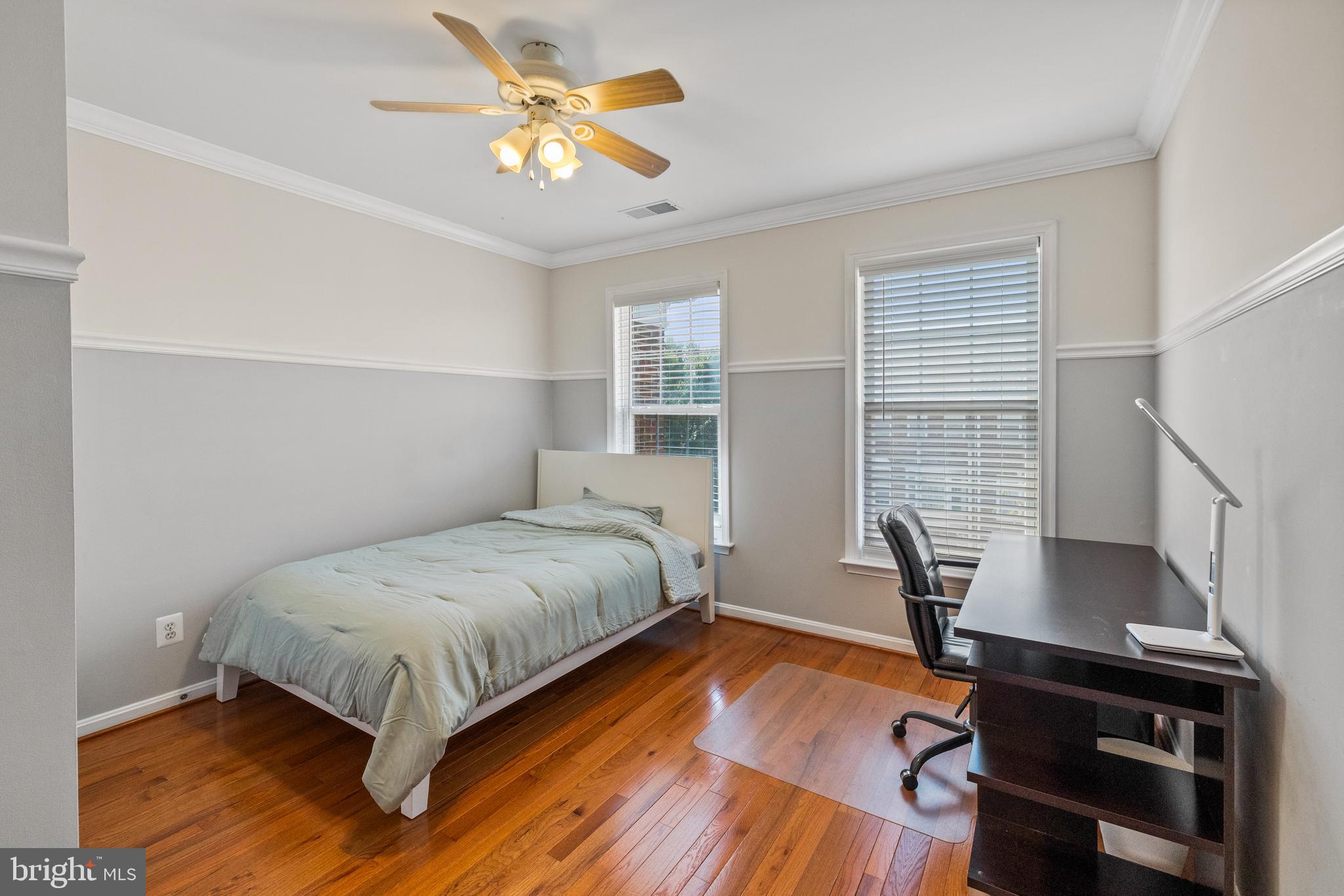 15016 Danube Way Haymarket, VA 20169 - Photo 13 of 22 a bedroom with a bed and a chandelier