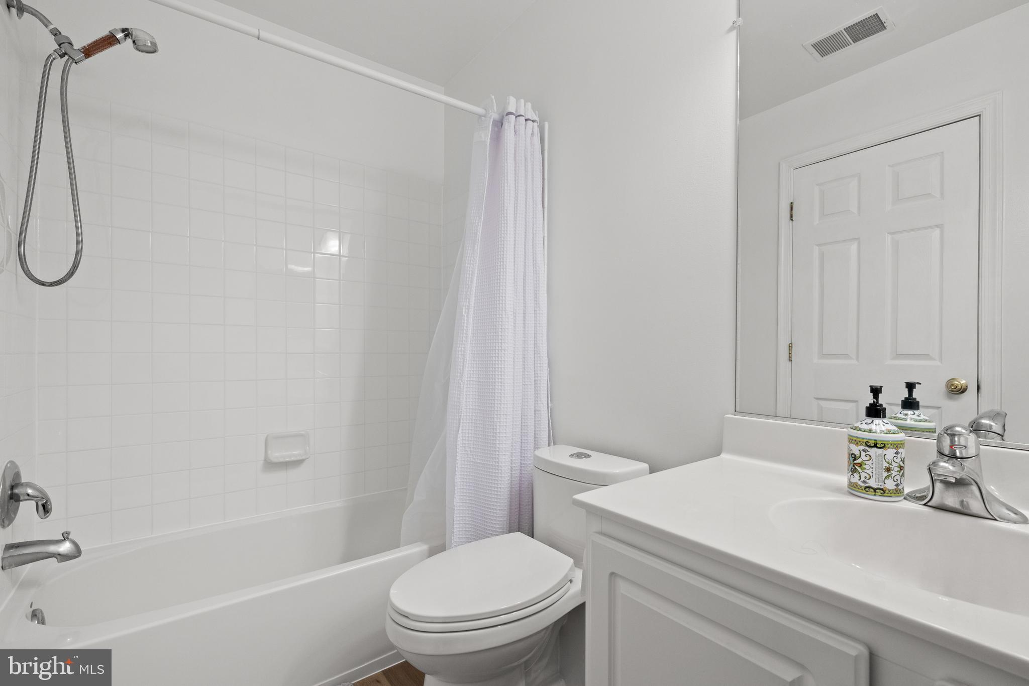 15016 Danube Way Haymarket, VA 20169 - Photo 14 of 22 a bathroom with a sink a toilet and shower