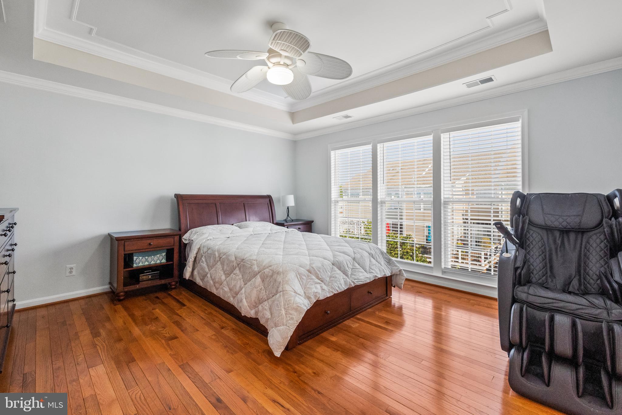 15016 Danube Way Haymarket, VA 20169 - Photo 9 of 22 a bedroom with a bed and wooden floor