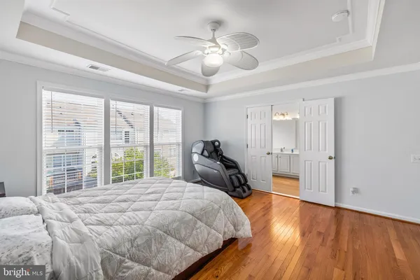 a bed room with a bed and a large window