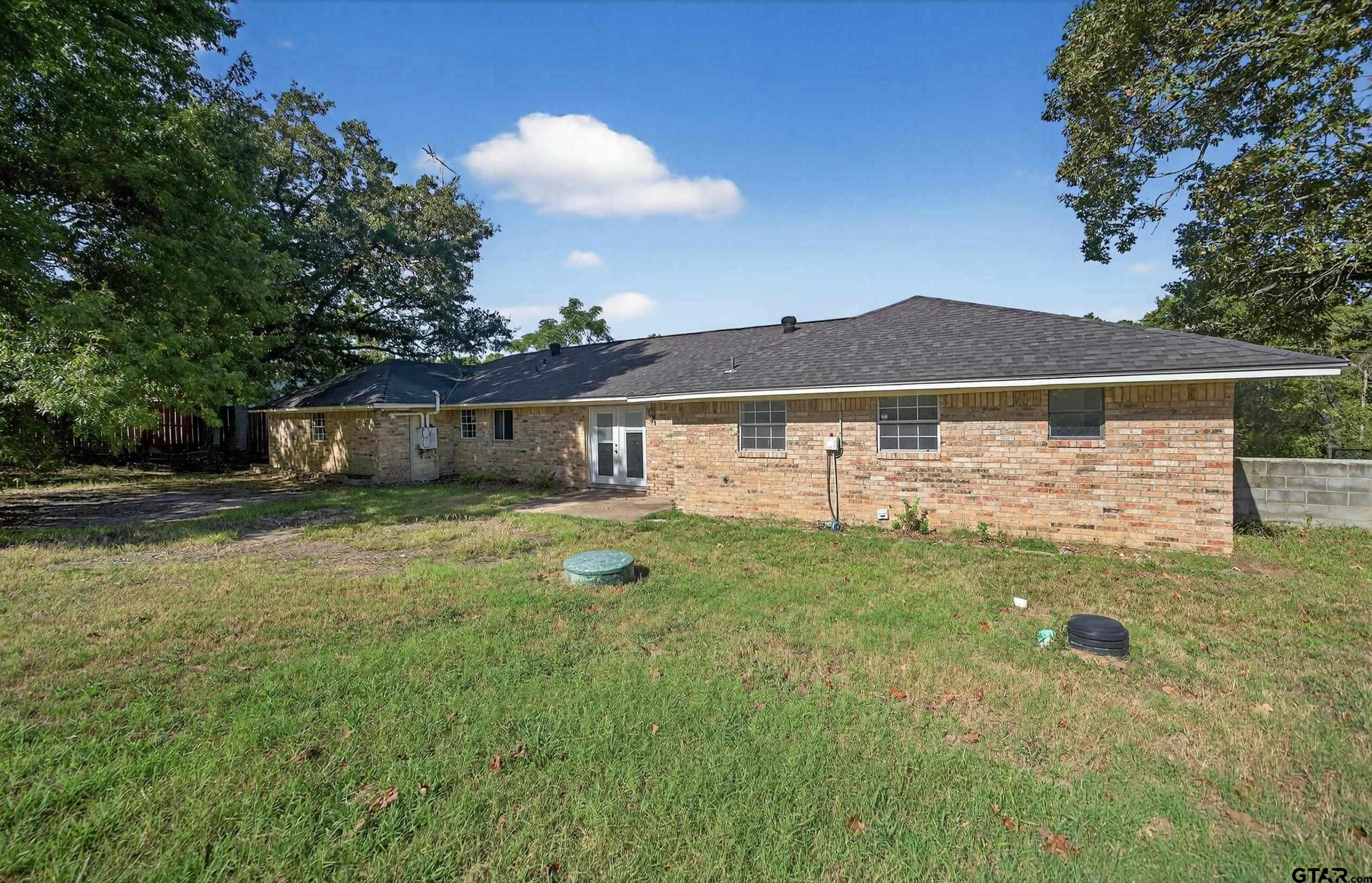 3408 Jackson Avenue Tyler, TX 75705 - Photo 6 of 45 a view of a house with a yard