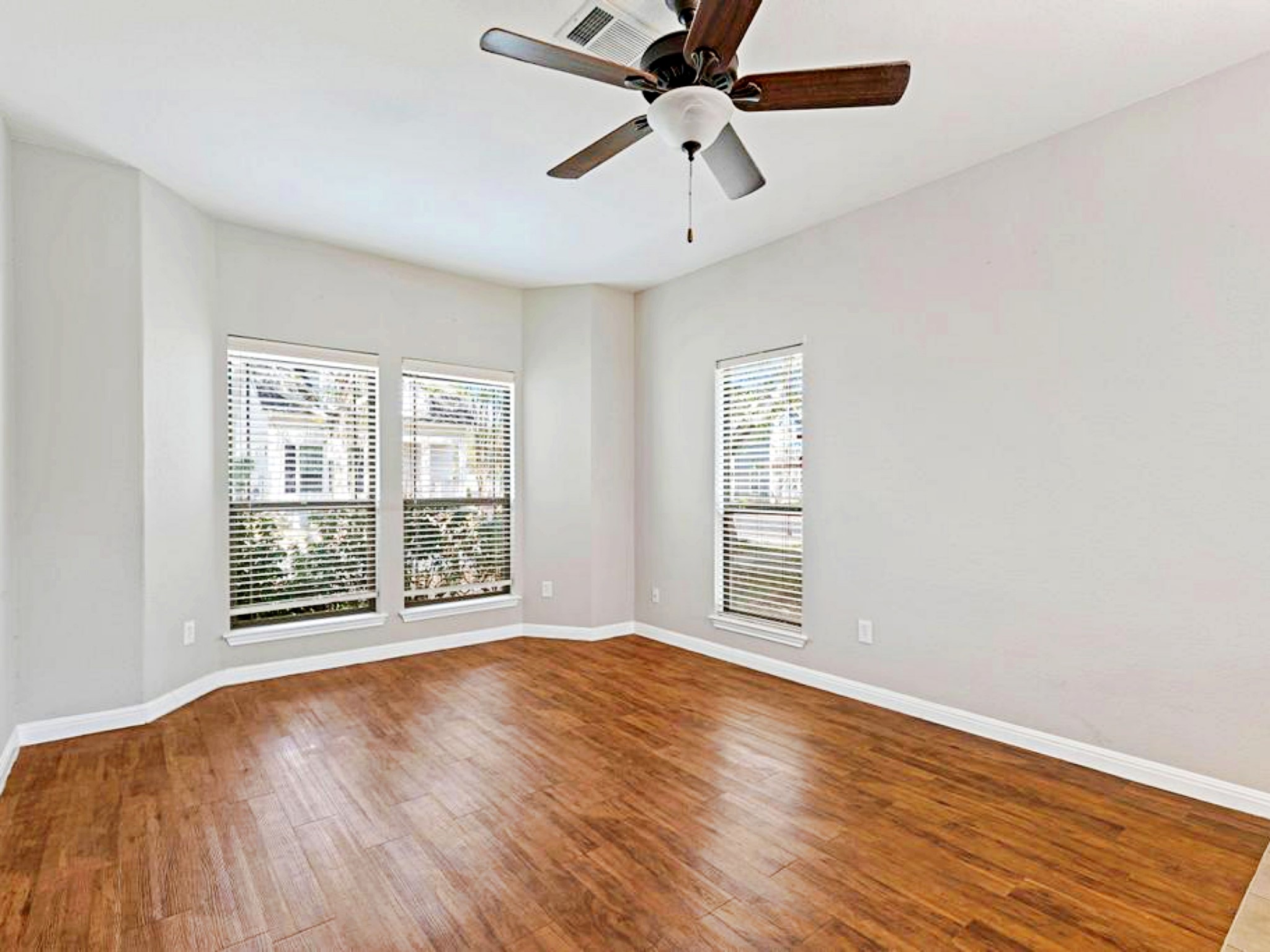 247 Cleveland Kyle, TX 78640 - Photo 13 of 19 Actual living shows stylish wide plank flooring in living