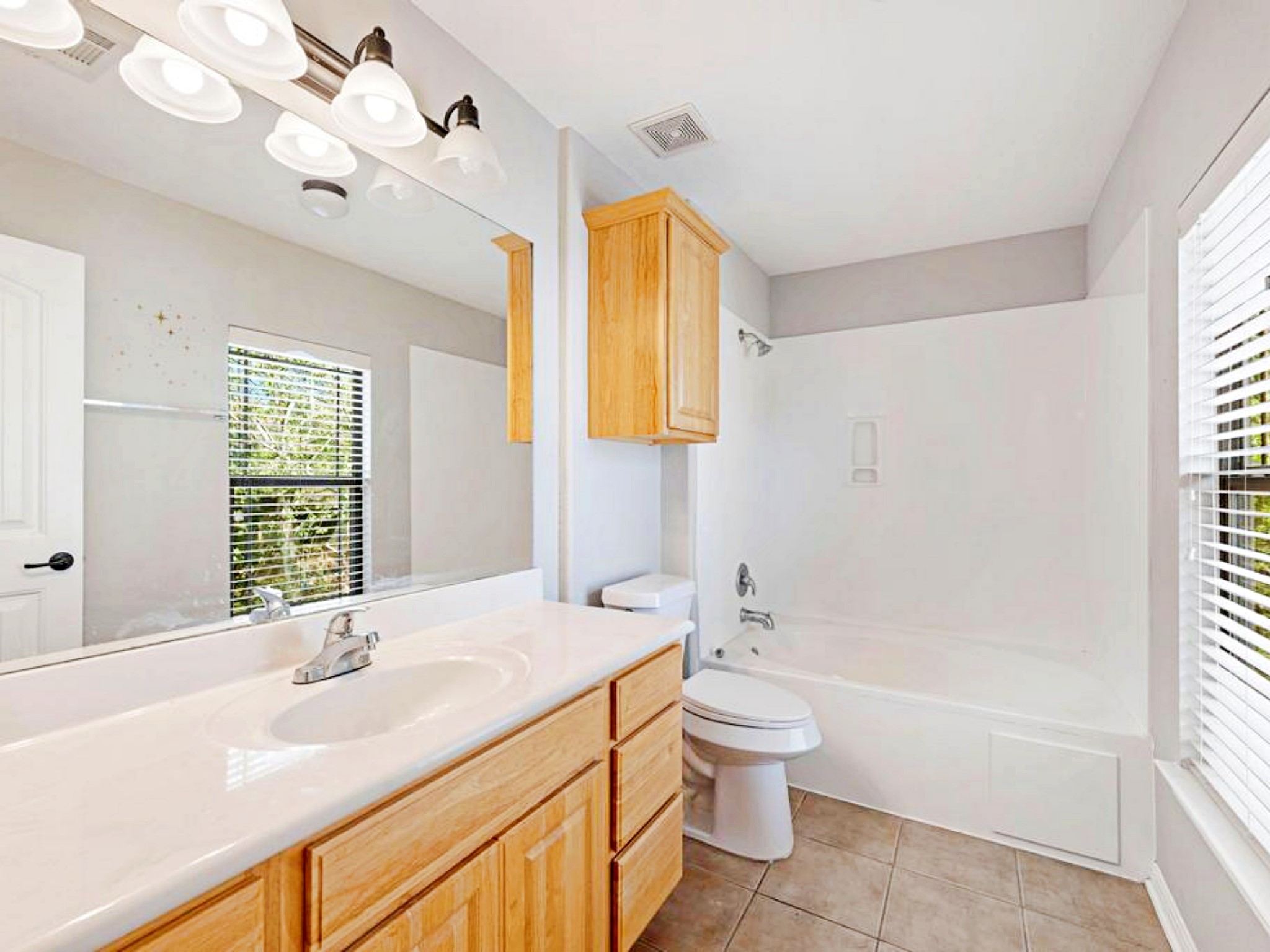 247 Cleveland Kyle, TX 78640 - Photo 8 of 19 Primary bathroom has a soaker tub and long vanity