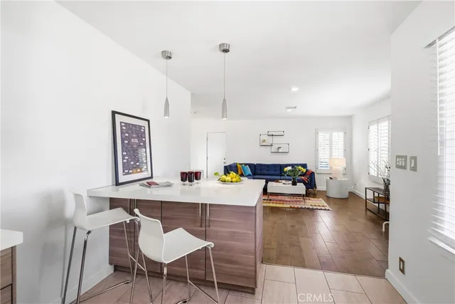 a dining room with furniture and a chandelier